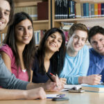 Smiling group of students in a library